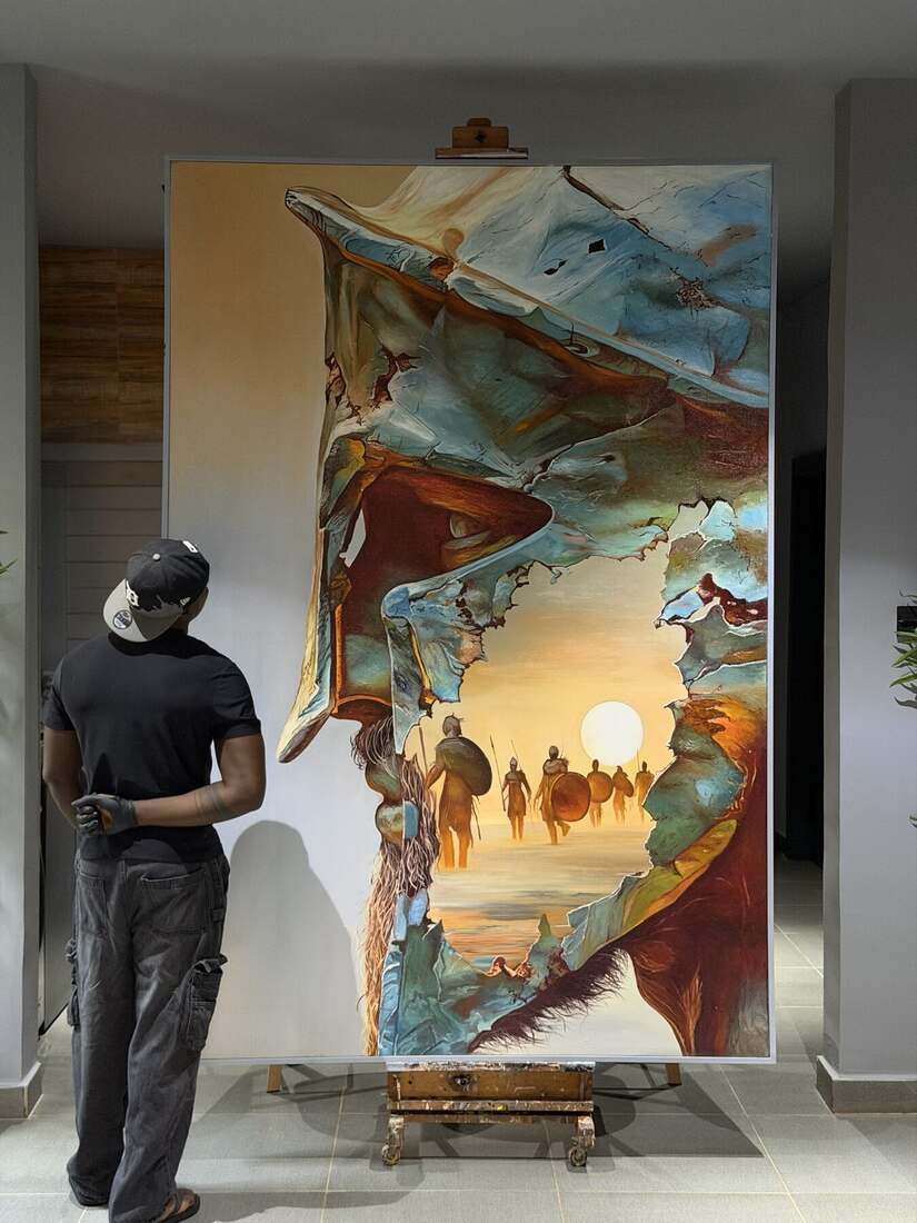 Yomi Bas painting in the studio